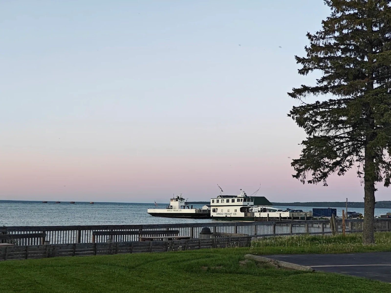 Arnold Freight Co. ferry boats docked on the St. Ignace waterfront at dusk