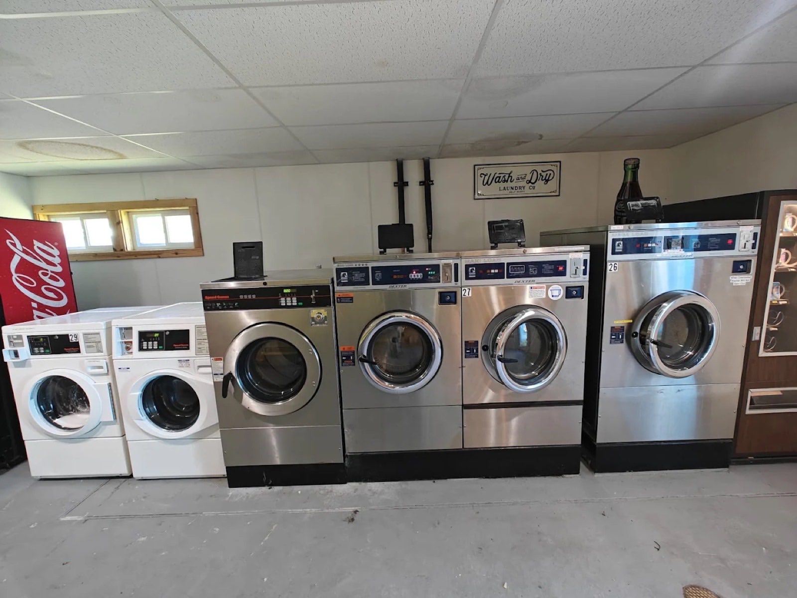 Large-capacity Dexter Maxi Load washers at Bayside Coin Laundry used for commercial linen loads